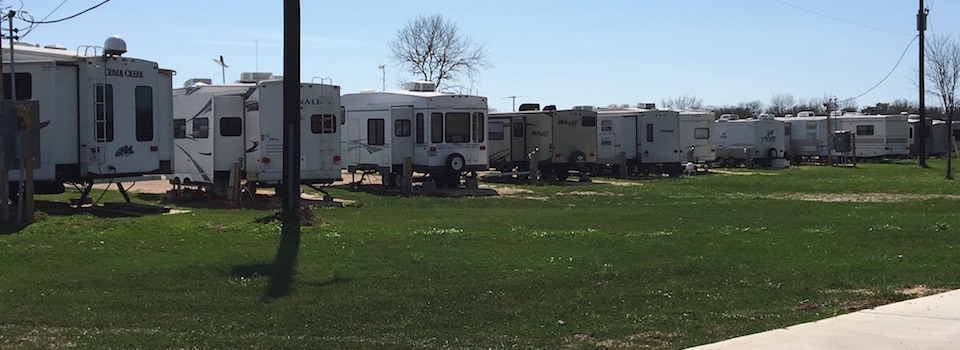 Row of RVs parked at Kountry Ranch RV Park